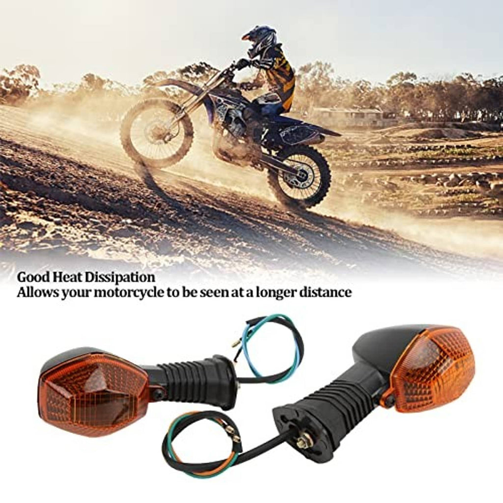 Amber front motorcycle turn signal lamp pair with black housings and visible wire leads