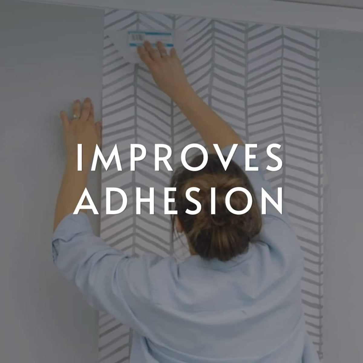 Peel and stick wallpaper with herringbone pattern after applying E-Z Hang helper