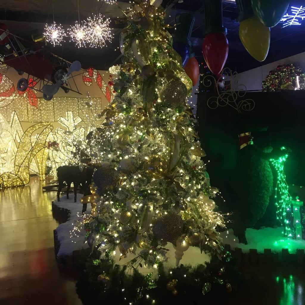 Mini starry string lights covering a decorated tabletop Christmas tree