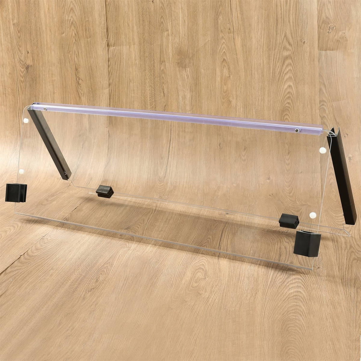 Clear windshield panel with black end brackets and metal frame for folding golf cart