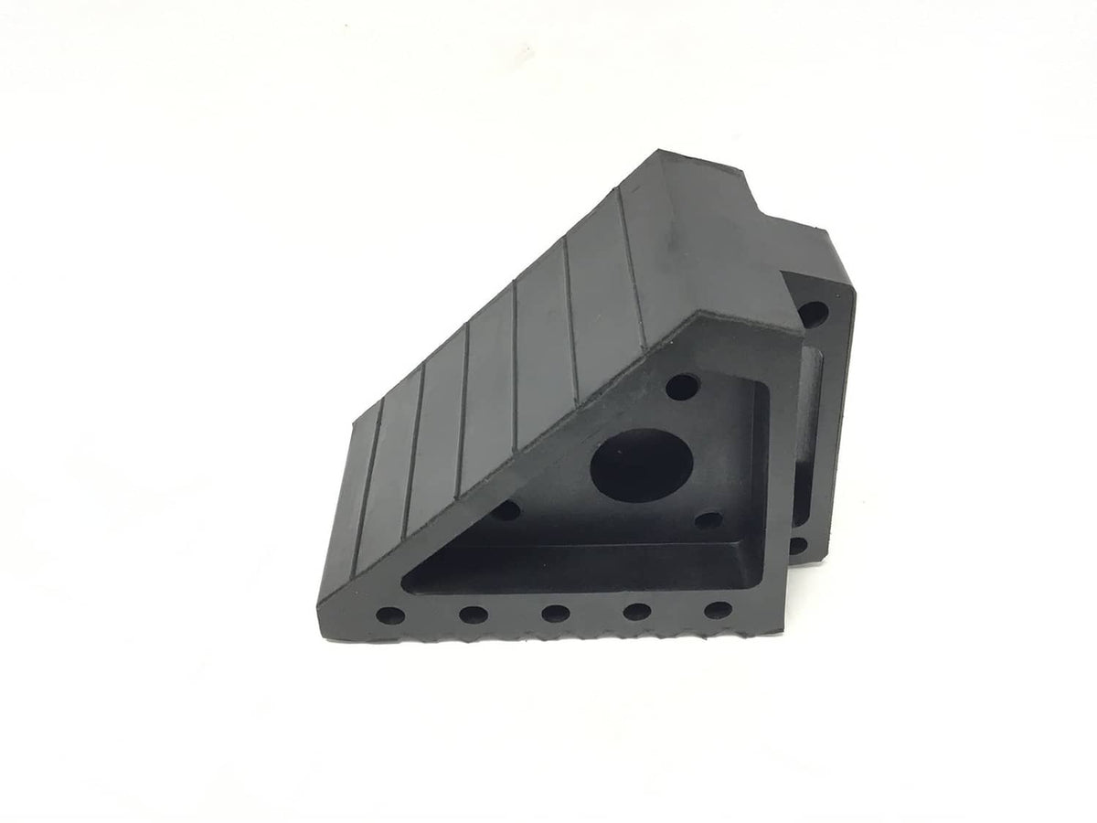 Black triangular rubber wheel chock with round recess and multiple bolt holes