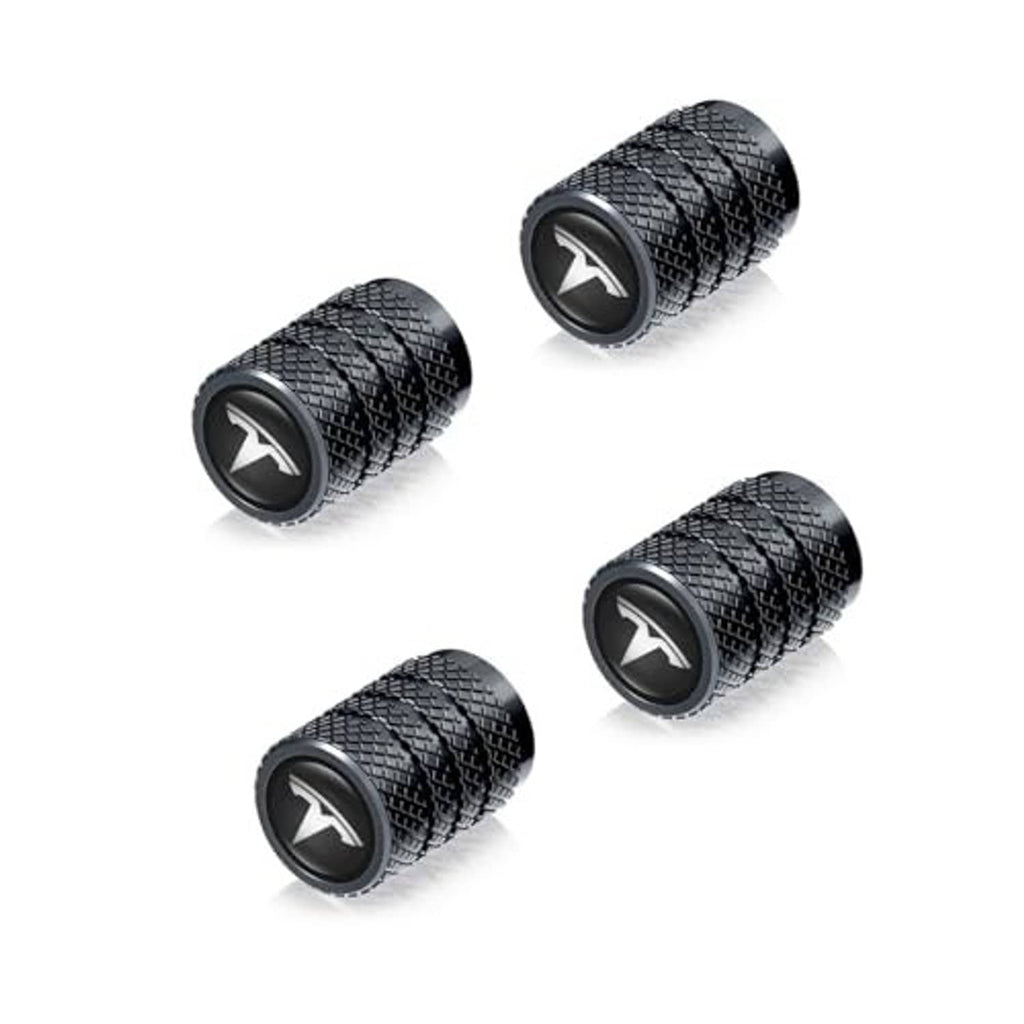 Five black textured tire valve stem caps with V-emblem tops