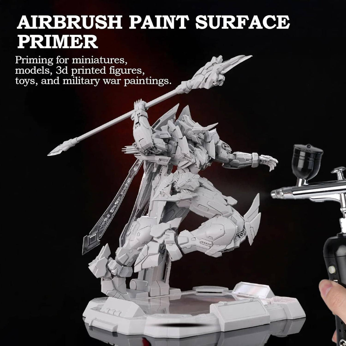 Grey airbrush primer paint being applied with an airbrush to a white model vehicle