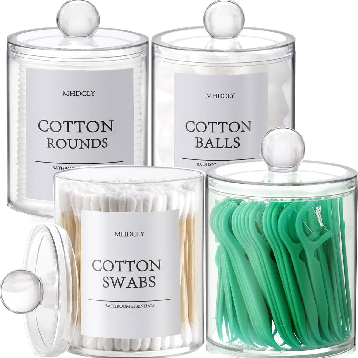 Four clear bathroom jars with round lids, including green cotton swabs and cotton rounds