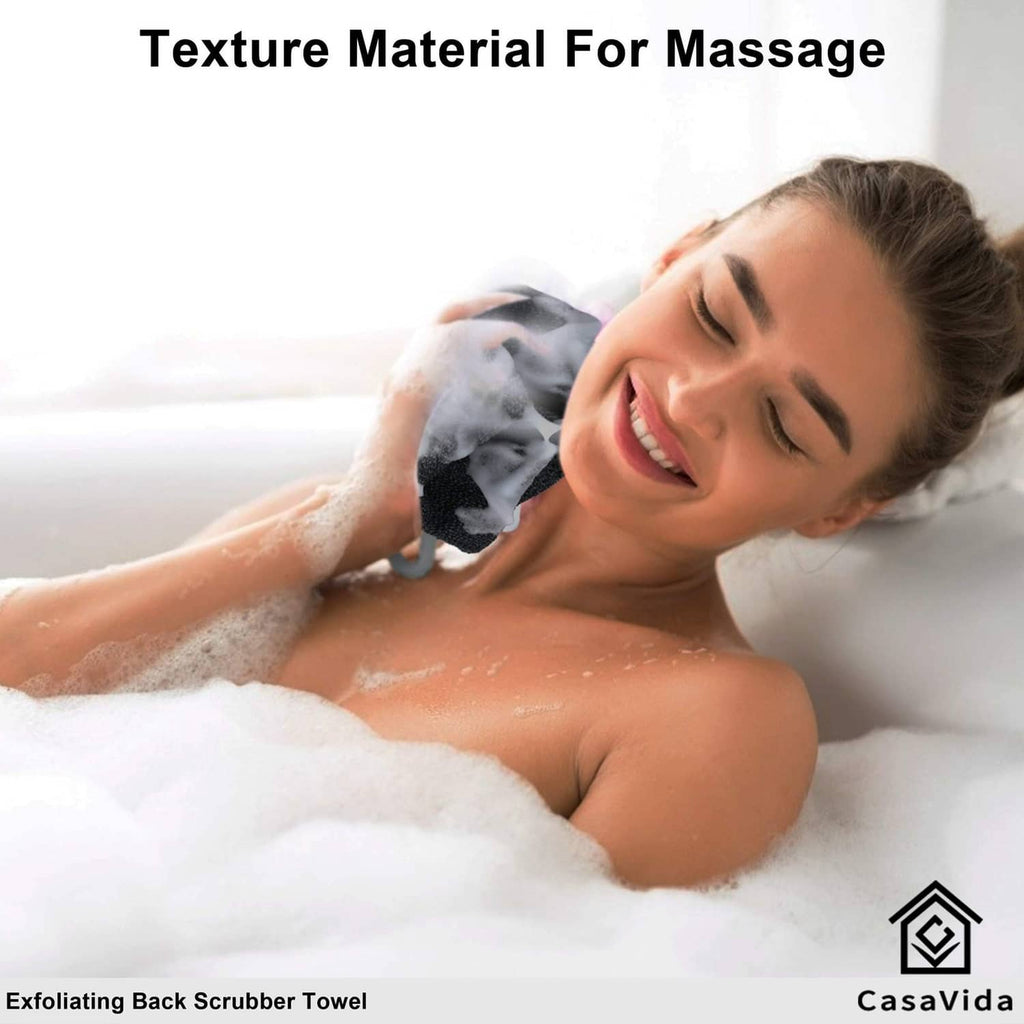 Dark gray exfoliating back scrubber towel held to back in shower