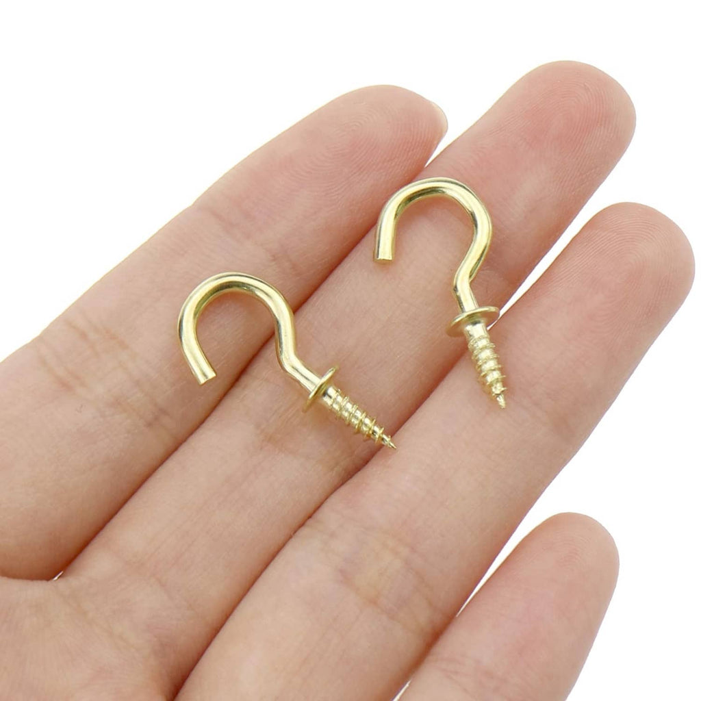 Gold cup hook screw with curved open end and pointed screw thread, on open palm
