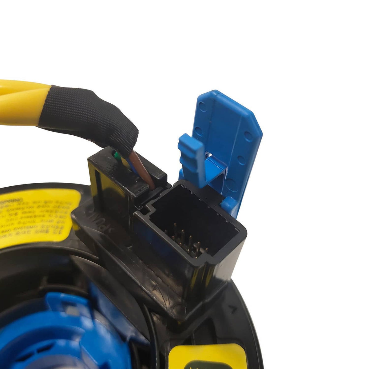 Clock spring wiring connector close-up with blue housing and black plastic body