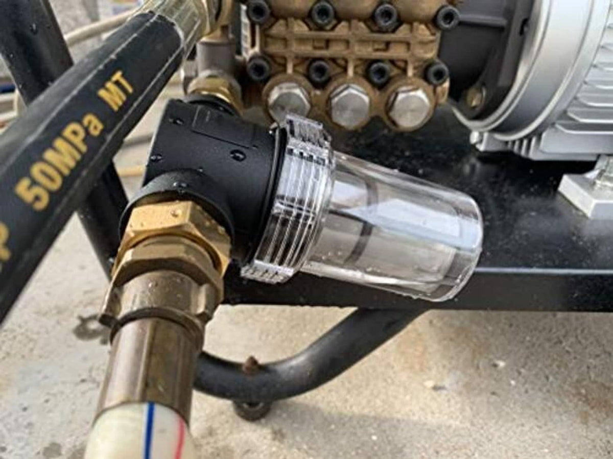 Installed inline water filter on pressure washer hose with clear housing and brass ends