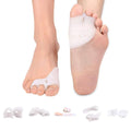 Soft white gel toe separator and bunion protector, worn on one foot