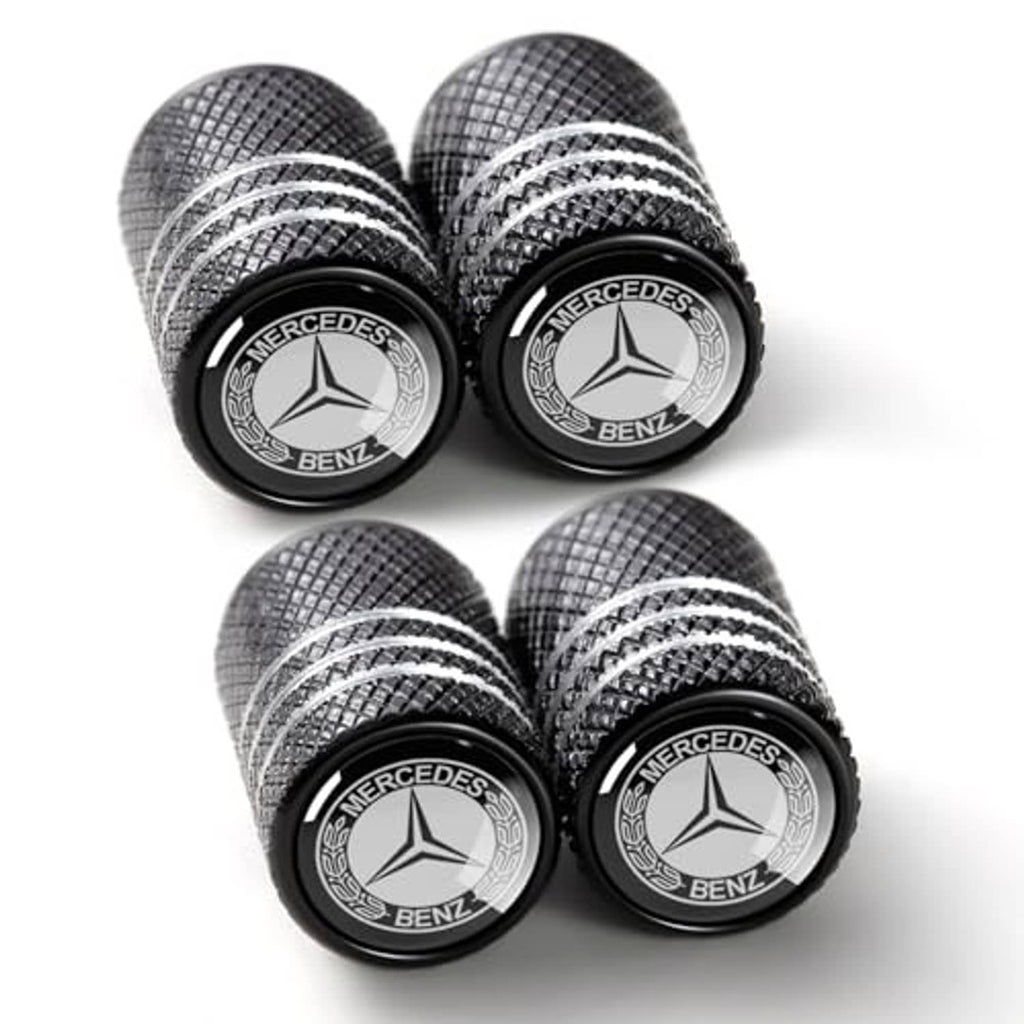 Four-pack black Mercedes-Benz tire valve stem caps with textured pattern and emblems