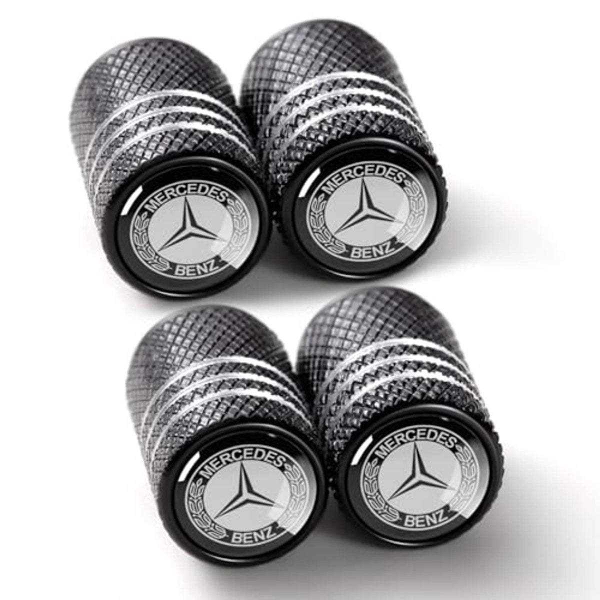 Four-pack black Mercedes-Benz tire valve stem caps with textured pattern and emblems