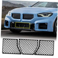 Front lower bumper grille mesh inserts, three black diamond-pattern panels