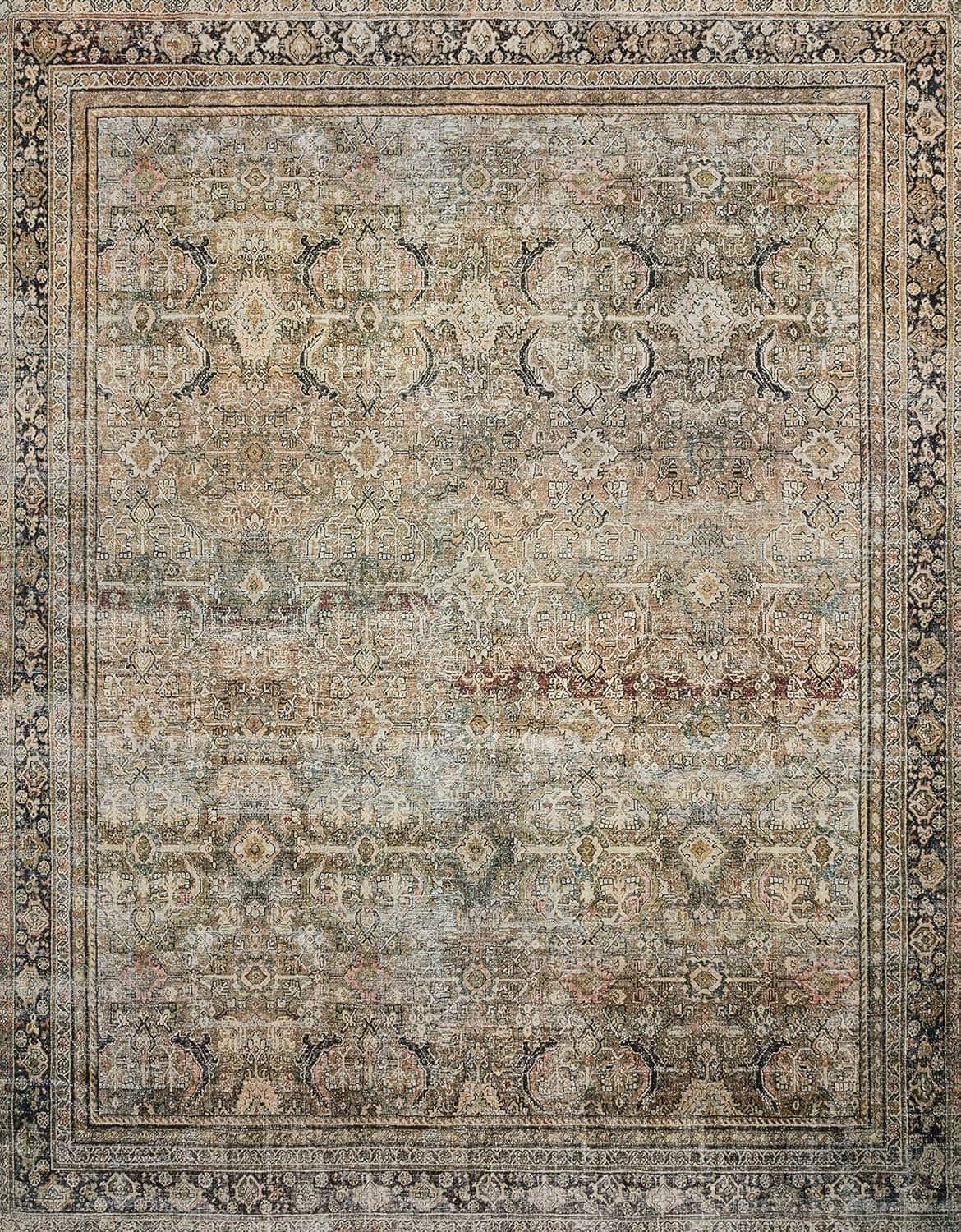 Close view of vintage area rug showing ornate medallion and border in olive and charcoal
