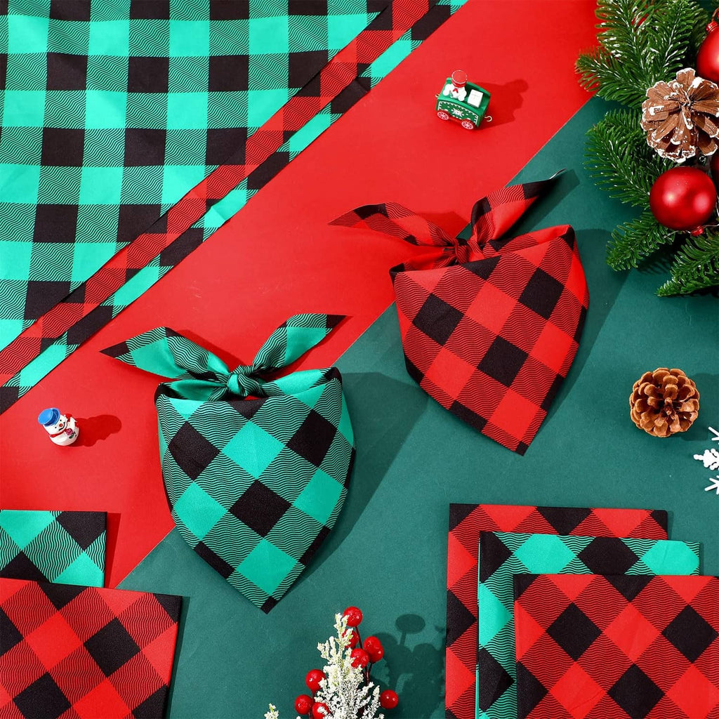Plaid red-and-green dog bandanas with black diamond pattern, folded and tied
