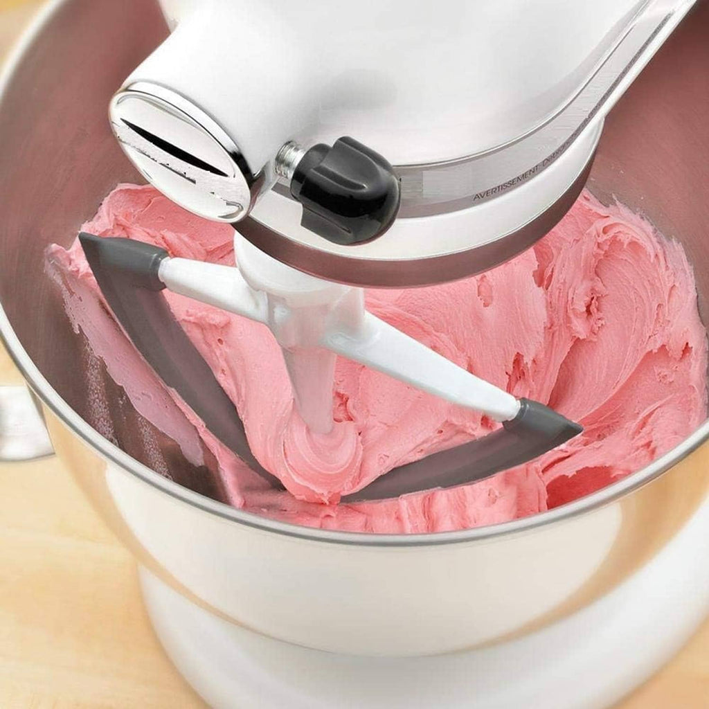 Flex edge beater mixing pink batter with white paddle and dark gray scraper edge