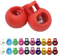 Plastic knitting needle stopper set, two red caps with spring insert and latch.