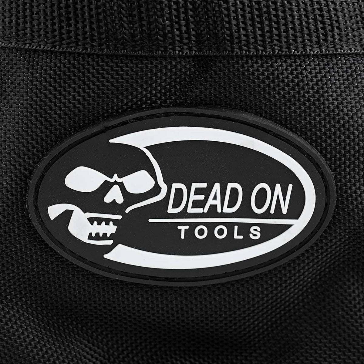 Close-up of black parachute bag oval patch logo reading DEAD ON TOOLS