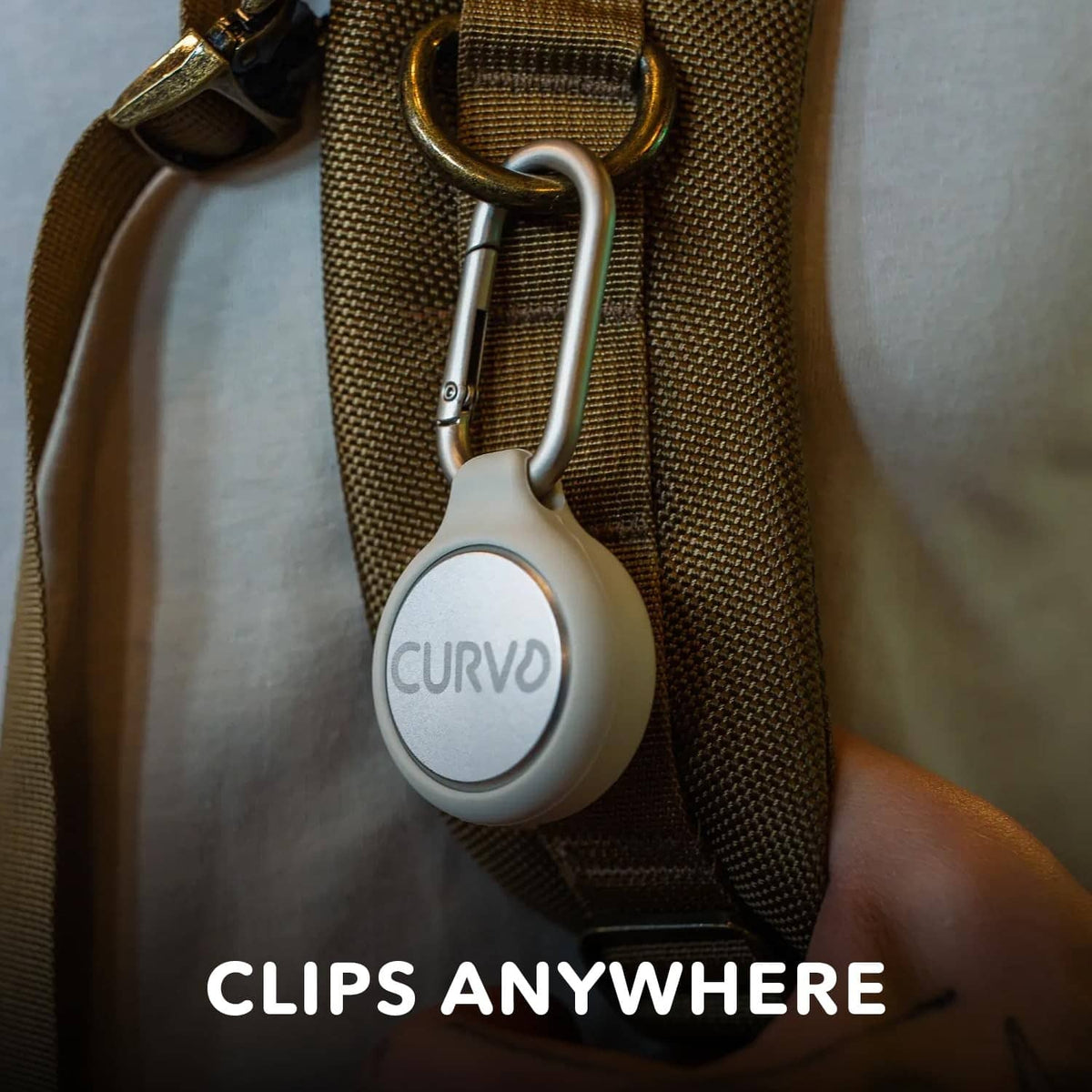 Round CURVO case on a webbing strap with metal carabiner clip