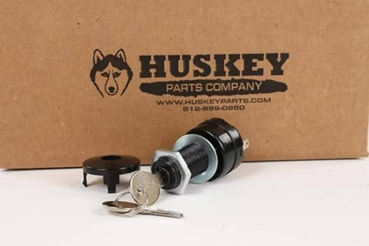 Golf cart ignition key switch with keys and silver barrel, HUSKEY box behind