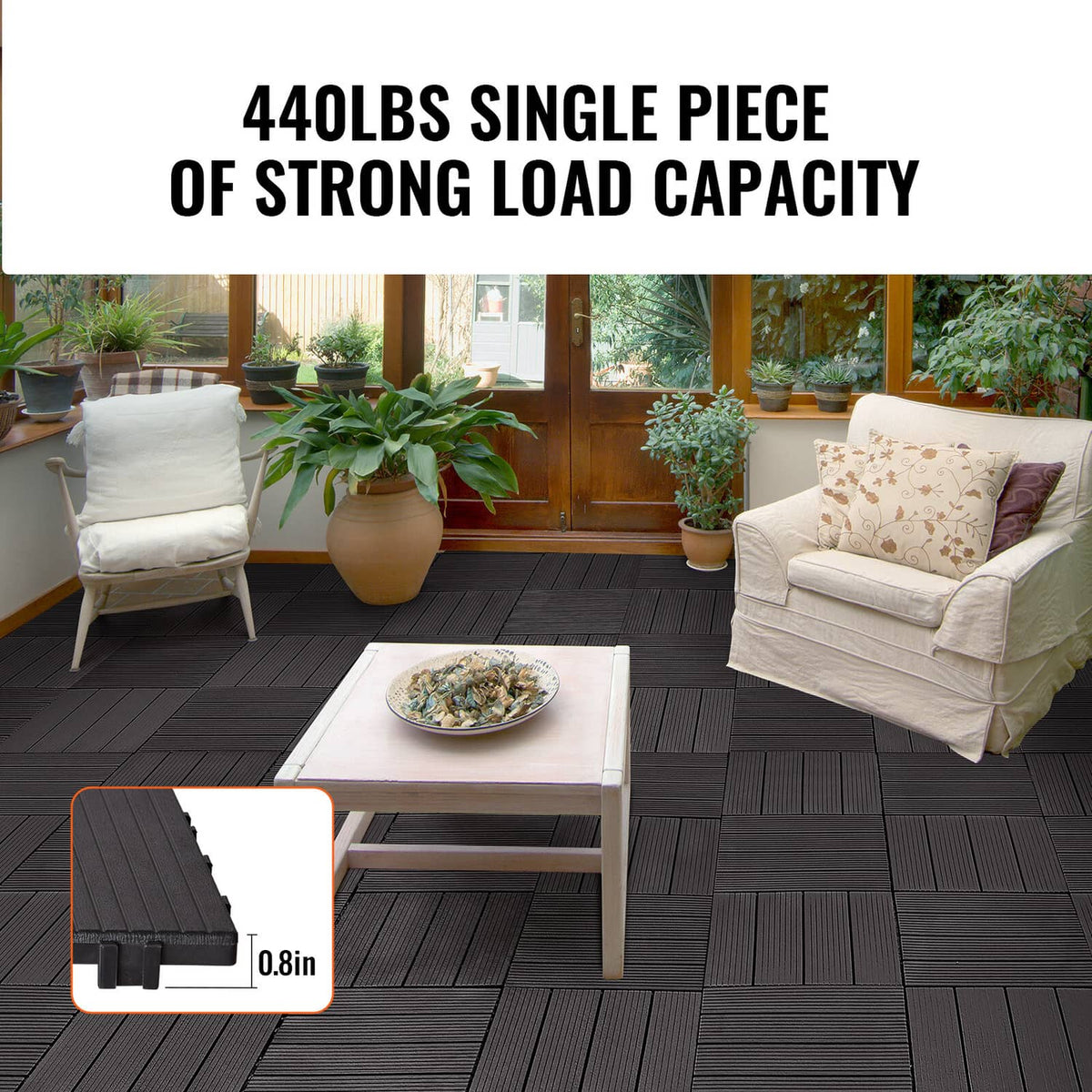 Dark brown interlocking deck tiles laid in a patio grid pattern with raised grooves