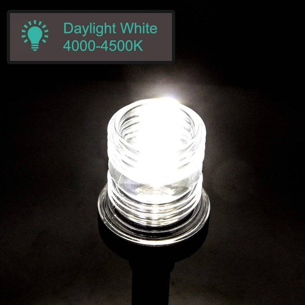 Bright Marine LED navigation light with clear lens showing white light glow and black base