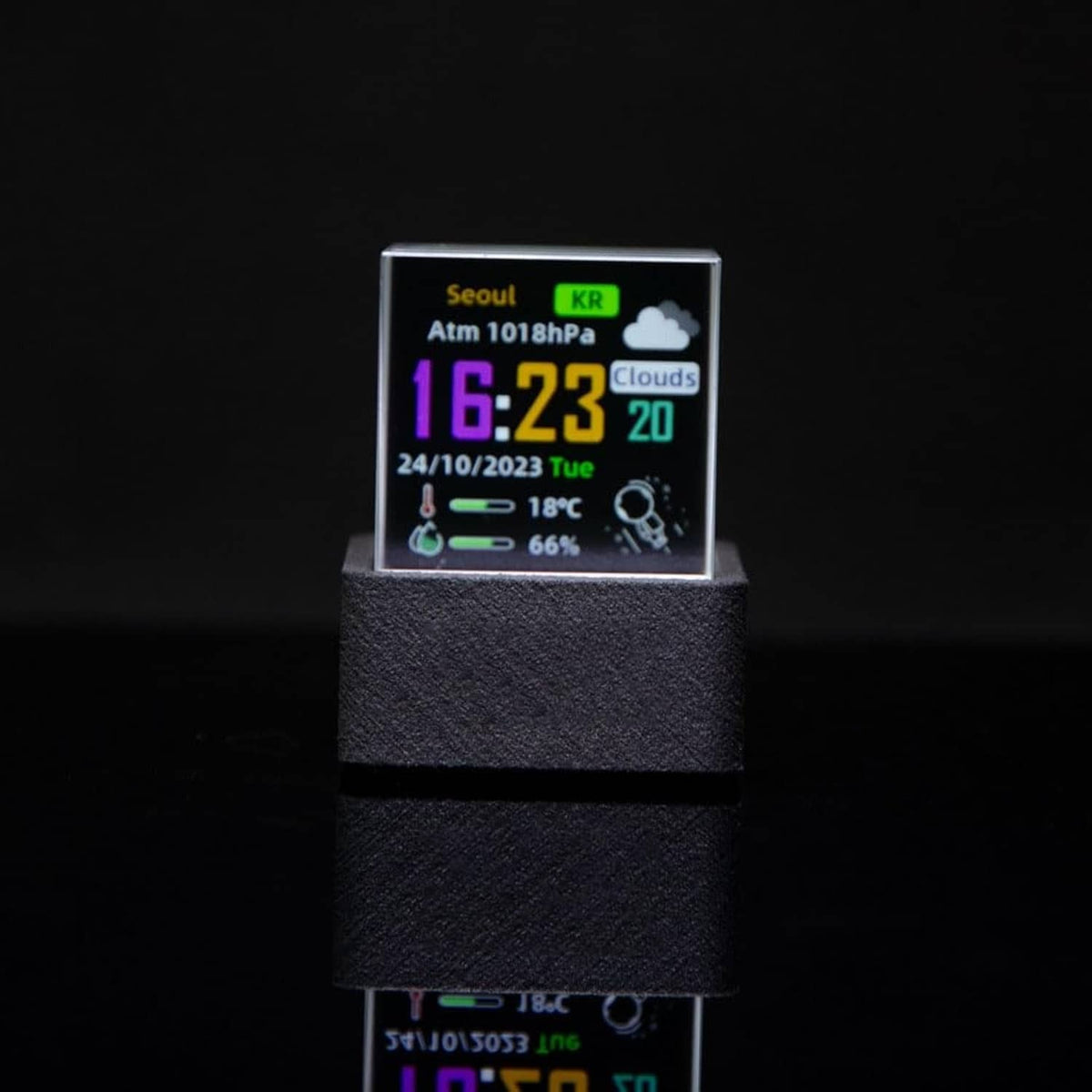 Holographic crystal display showing Seoul weather details on small screen