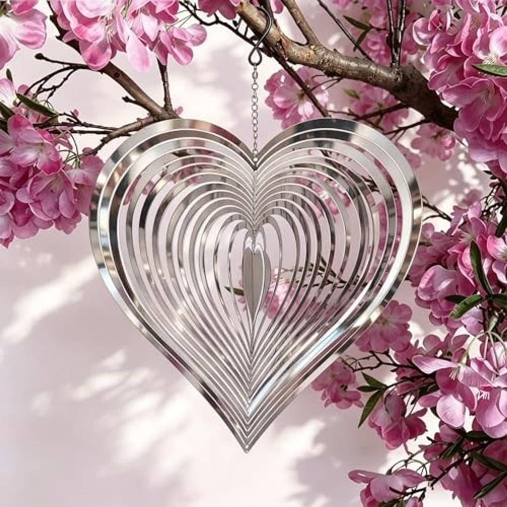 Reflective silver heart wind spinner with hanging chain, layered mirror-like metal rings