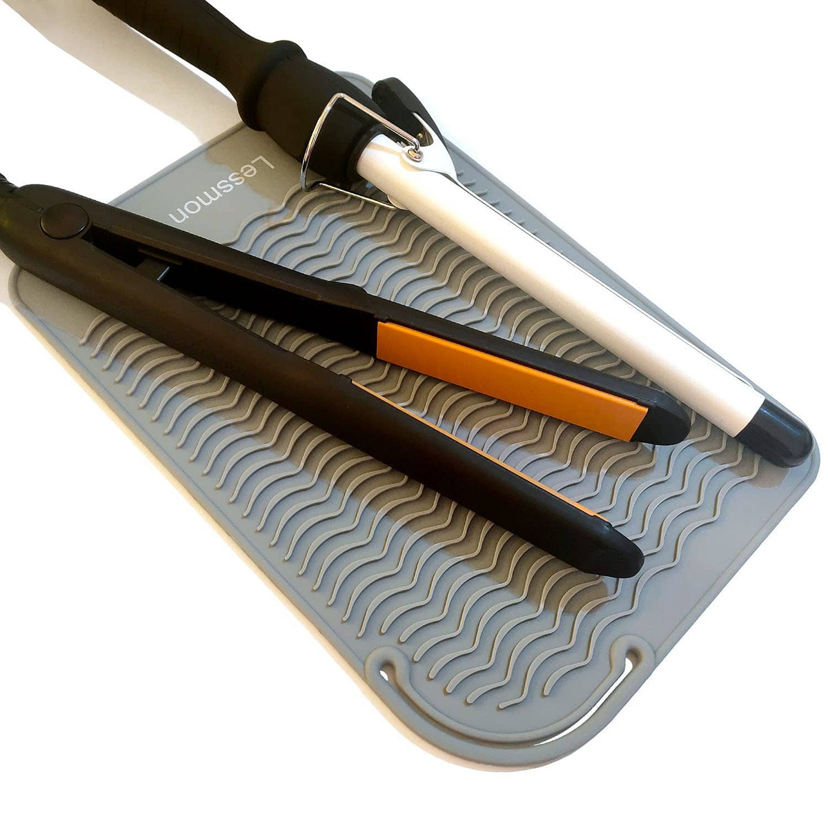 Heat-resistant styling mat with two flat iron tools resting in molded channels