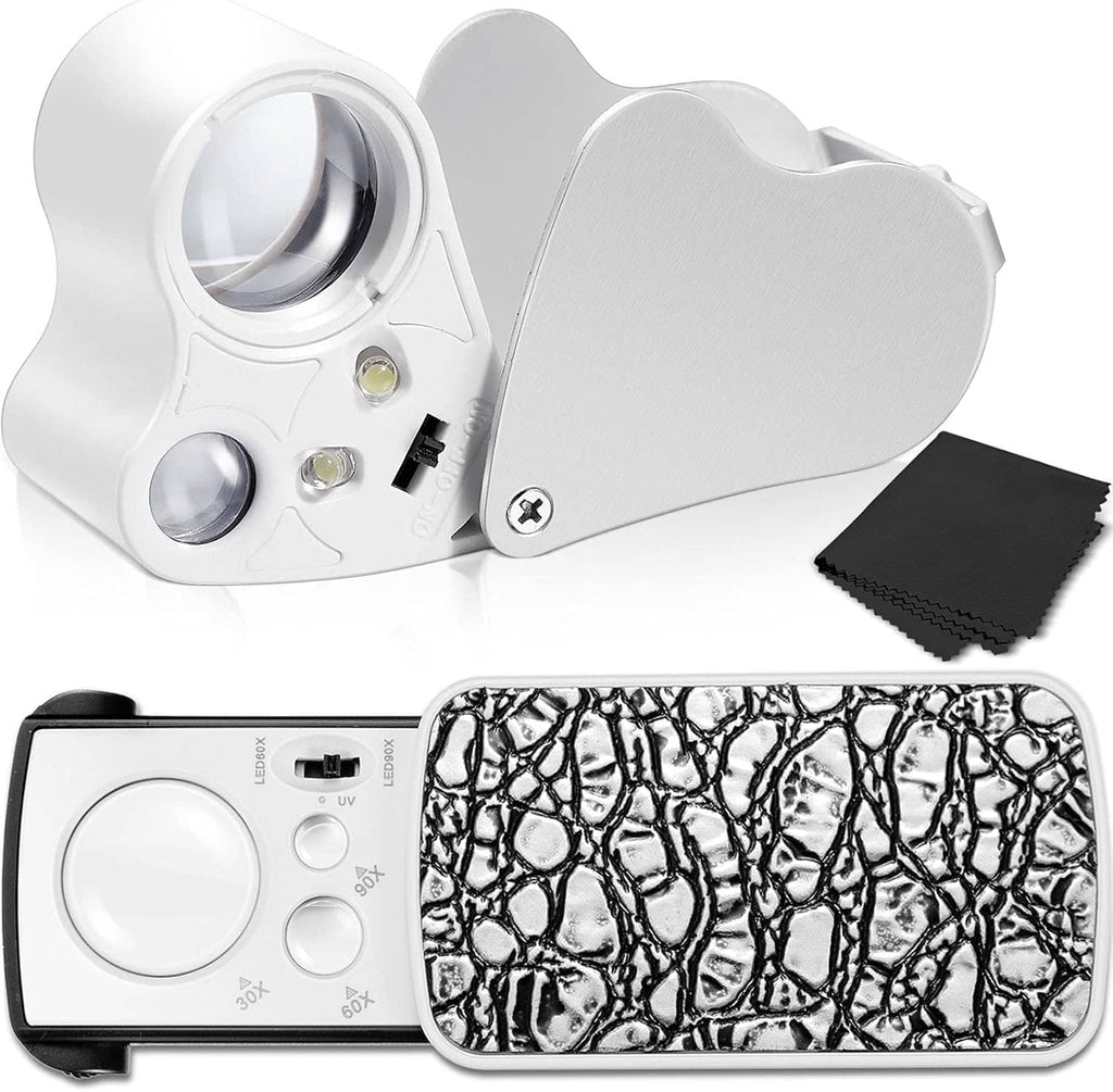 Illuminated jewelers loupe with fold-open lens and black textured cover, white housing