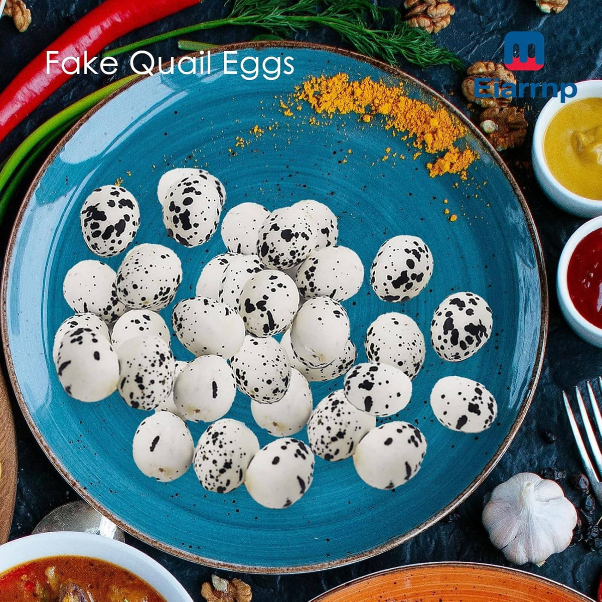 Artificial quail eggs on teal plate, white shells with black speckles