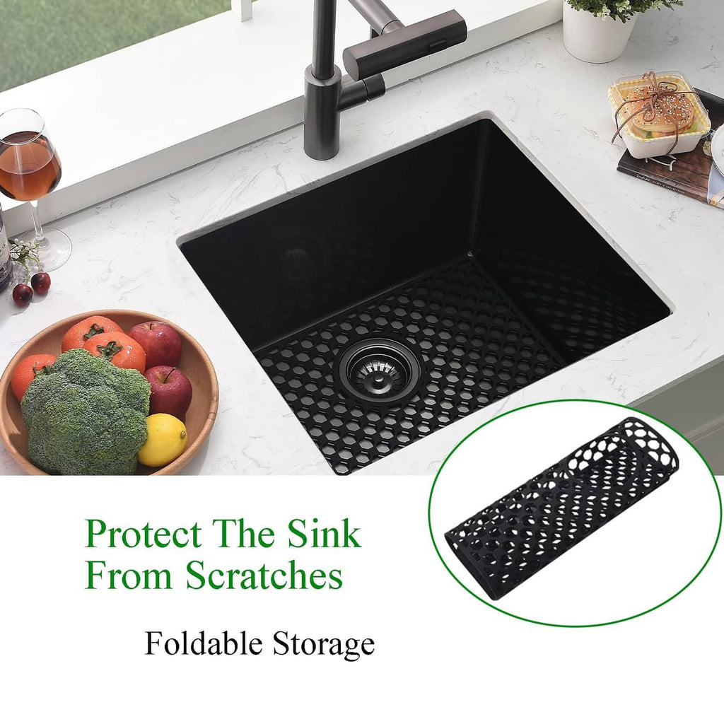 Black silicone sink mat with circular drain hole and hexagonal dot grid