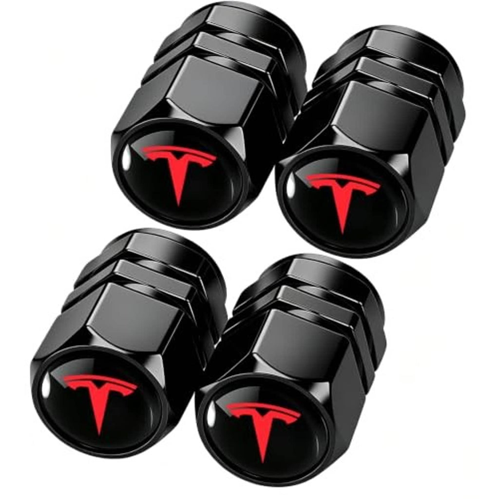Four black metal tire valve stem caps with red emblem, hex collar and textured grip