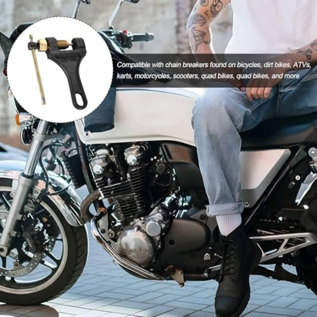 Motorcycle chain breaker tool mounted in hand position with long lever rod and loop handle