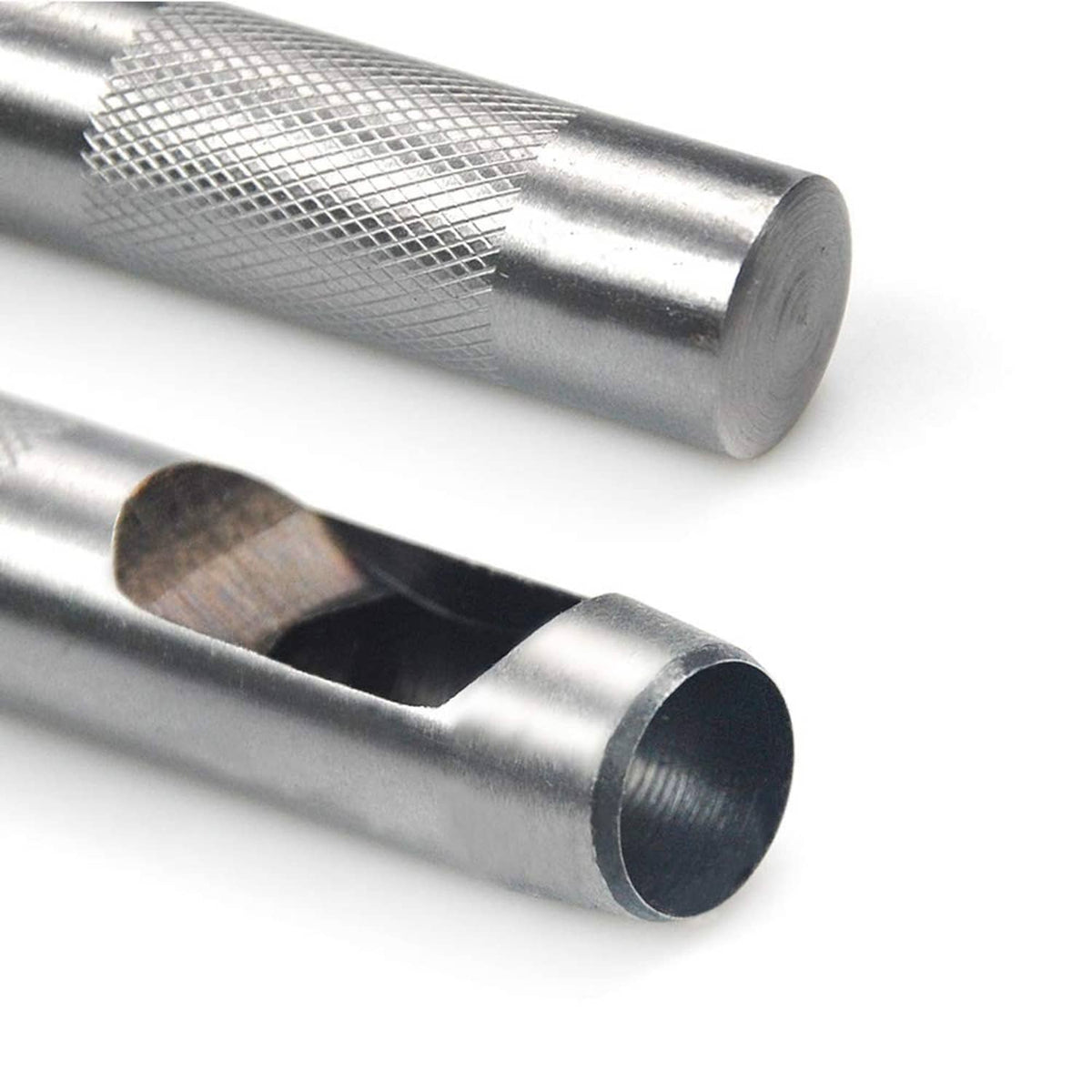 Silver hollow punch dies with cylindrical cutting openings, shown close-up