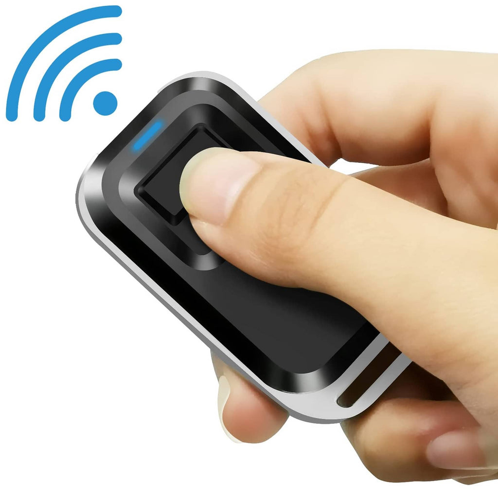 Black one-button RF gate remote with blue LED indicator, hand pressing