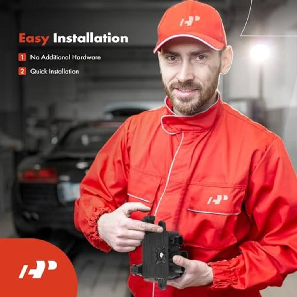 Technician holding engine cooling fan control module with electrical connectors