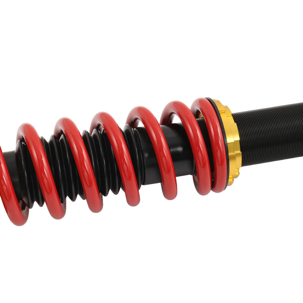 Close-up of red and black coil spring on adjustable coilover strut with gold cap
