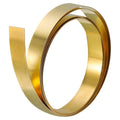 Brass foil sheet roll, shiny gold metal strip wound into a tight coil