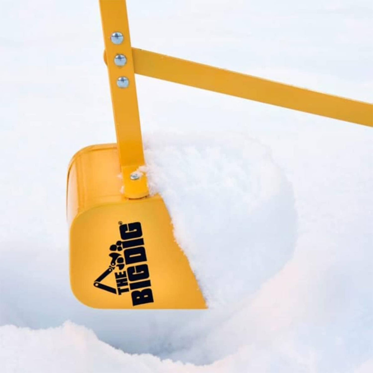Yellow digging bucket with THE BIG DIG logo, attached to black-and-yellow bar.