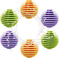 Colorful ribbed dryer balls: orange, green, and purple reusable laundry agitator set