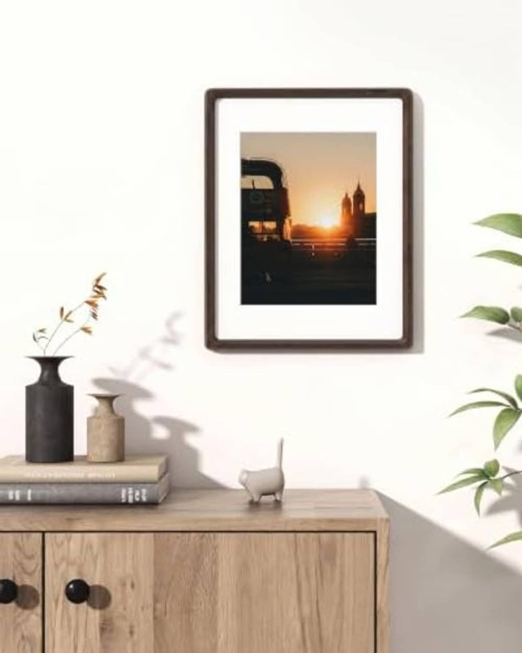 Dark wenge 11x14 picture frame hanging on wall with small landscape photo
