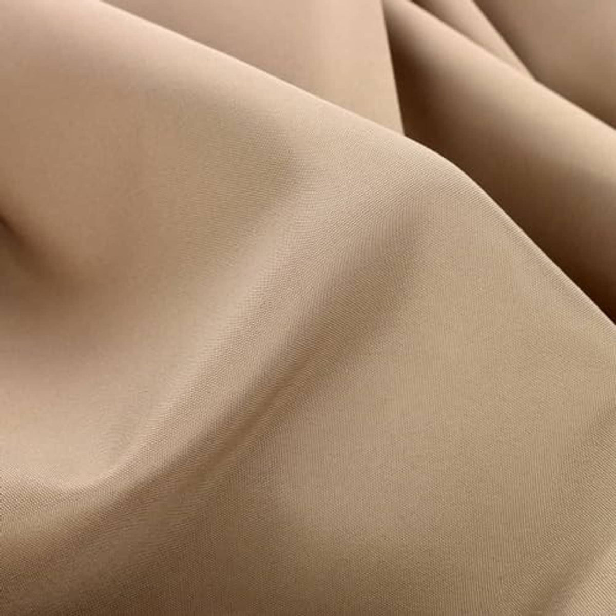 Beige umbrella cover fabric folds, close-up