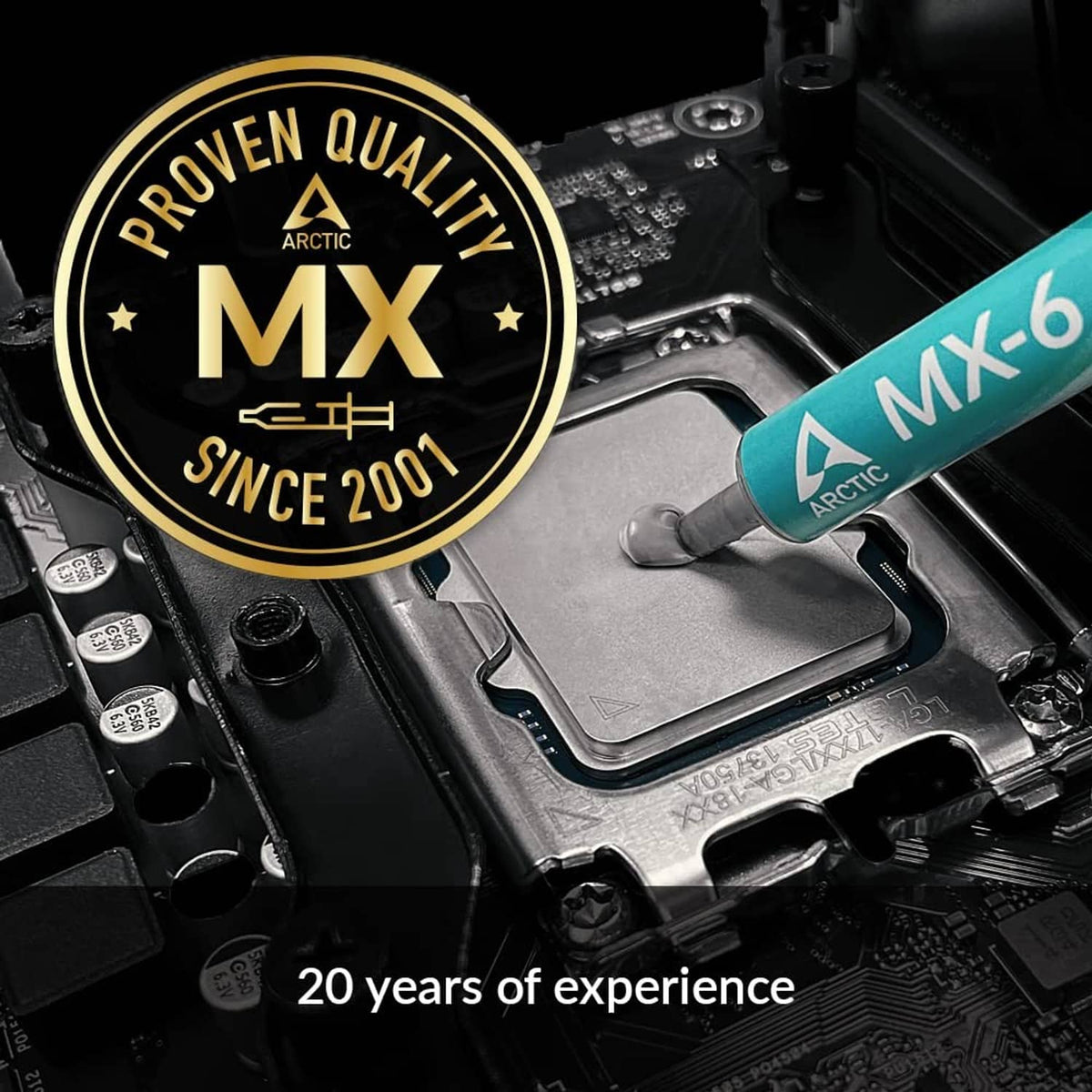 ARCTIC MX-6 thermal paste syringe in teal beside CPU socket