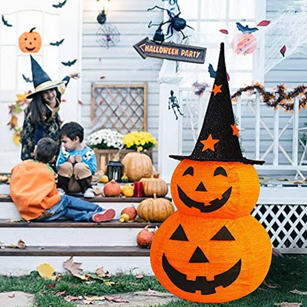 Pre-lit Halloween pumpkin decoration with black witch hat and glowing jack-o’-lantern