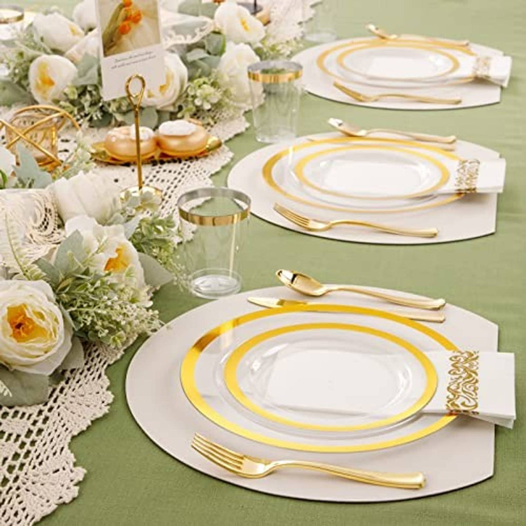Event table setting with gold-rim plates, clear cups, and gold cutlery