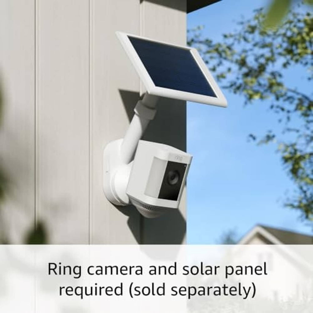 White outdoor security camera with dark solar panel mounted on wall