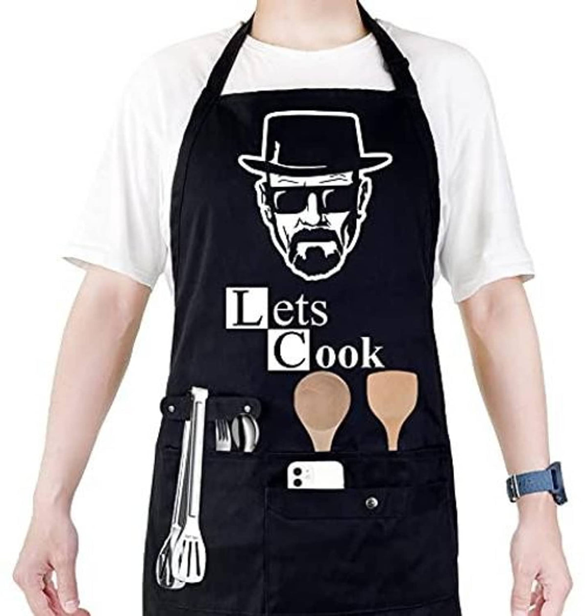 Black chef apron with "Let's Cook" graphic, utensil holder and front pocket