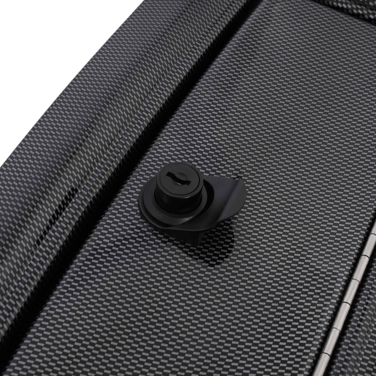 Dash kit lock knob and metal screws on carbon-fiber trim