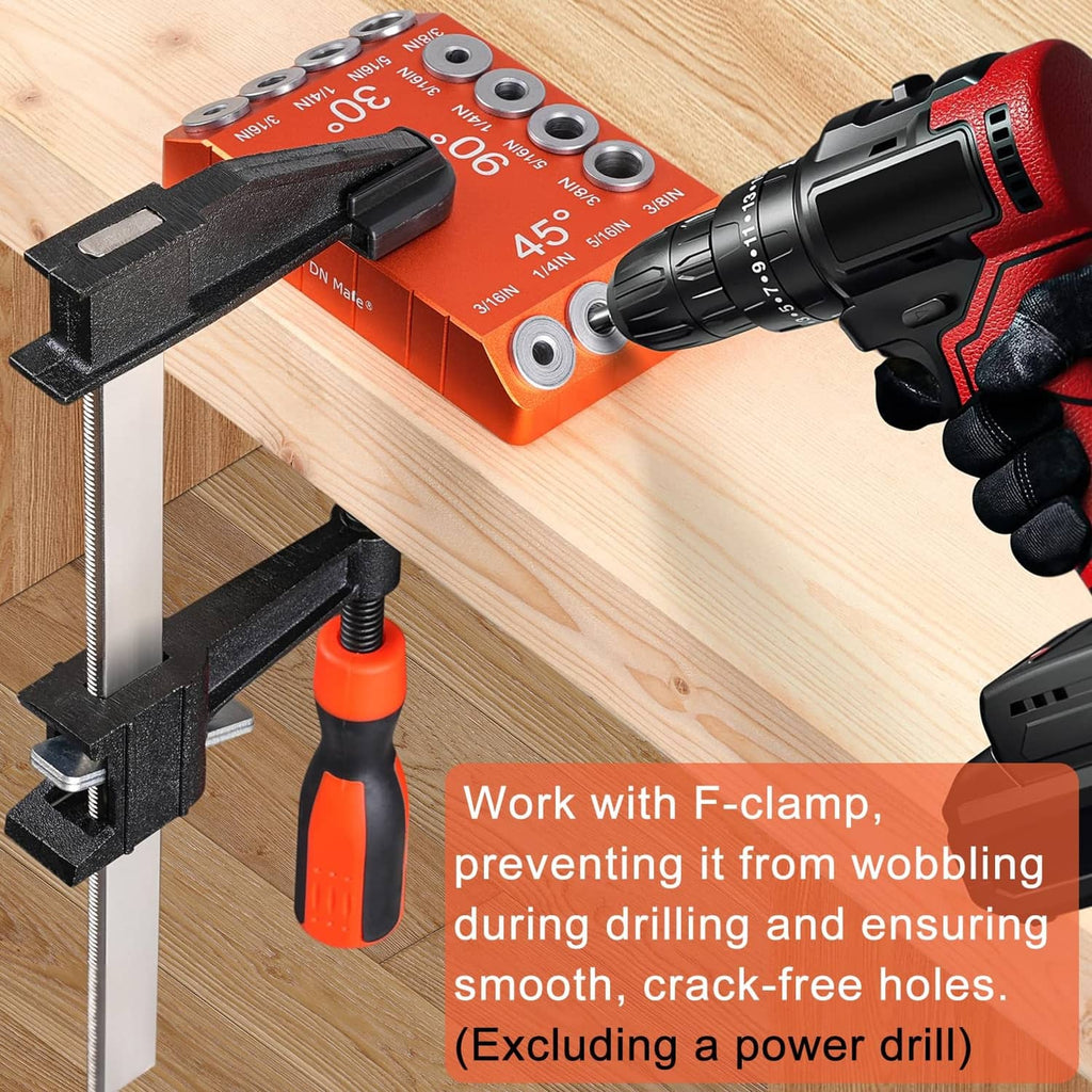 Orange drill guide jig clamped to wood with black F-clamp and drill bit