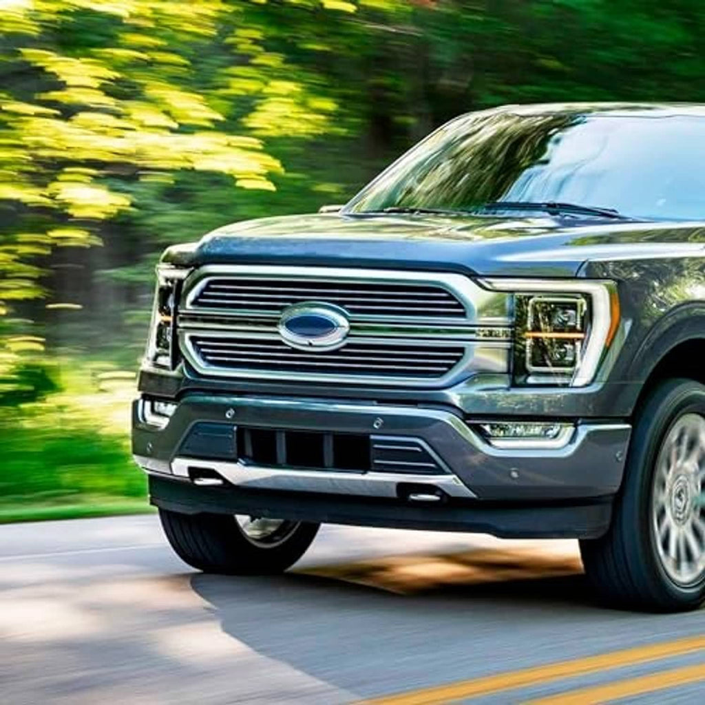 Black front lower center bumper grille on blue Ford F-150 front view